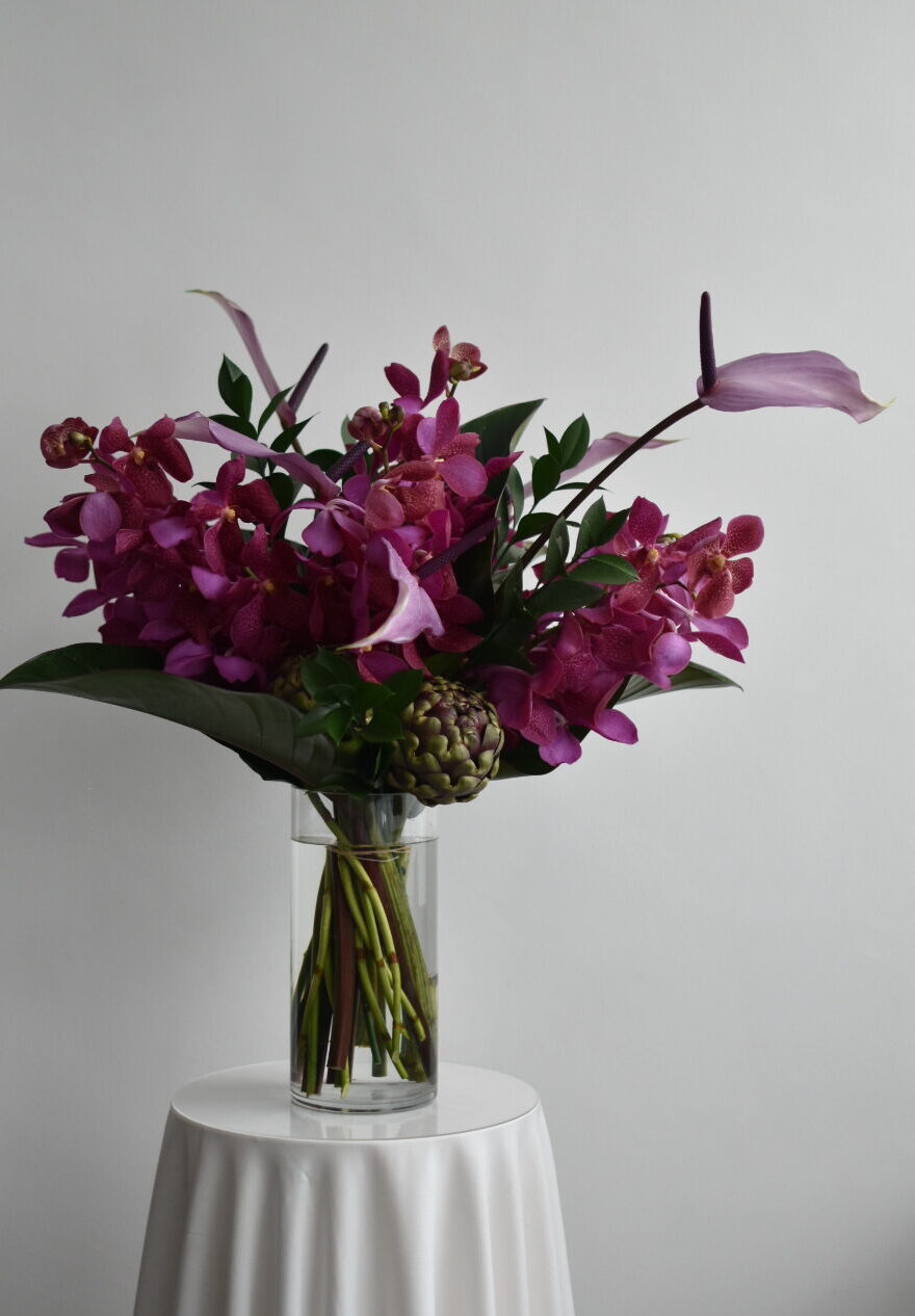 Corporate floral display with tropical foliage by WOOLLAHRA STUDIO in Singapore