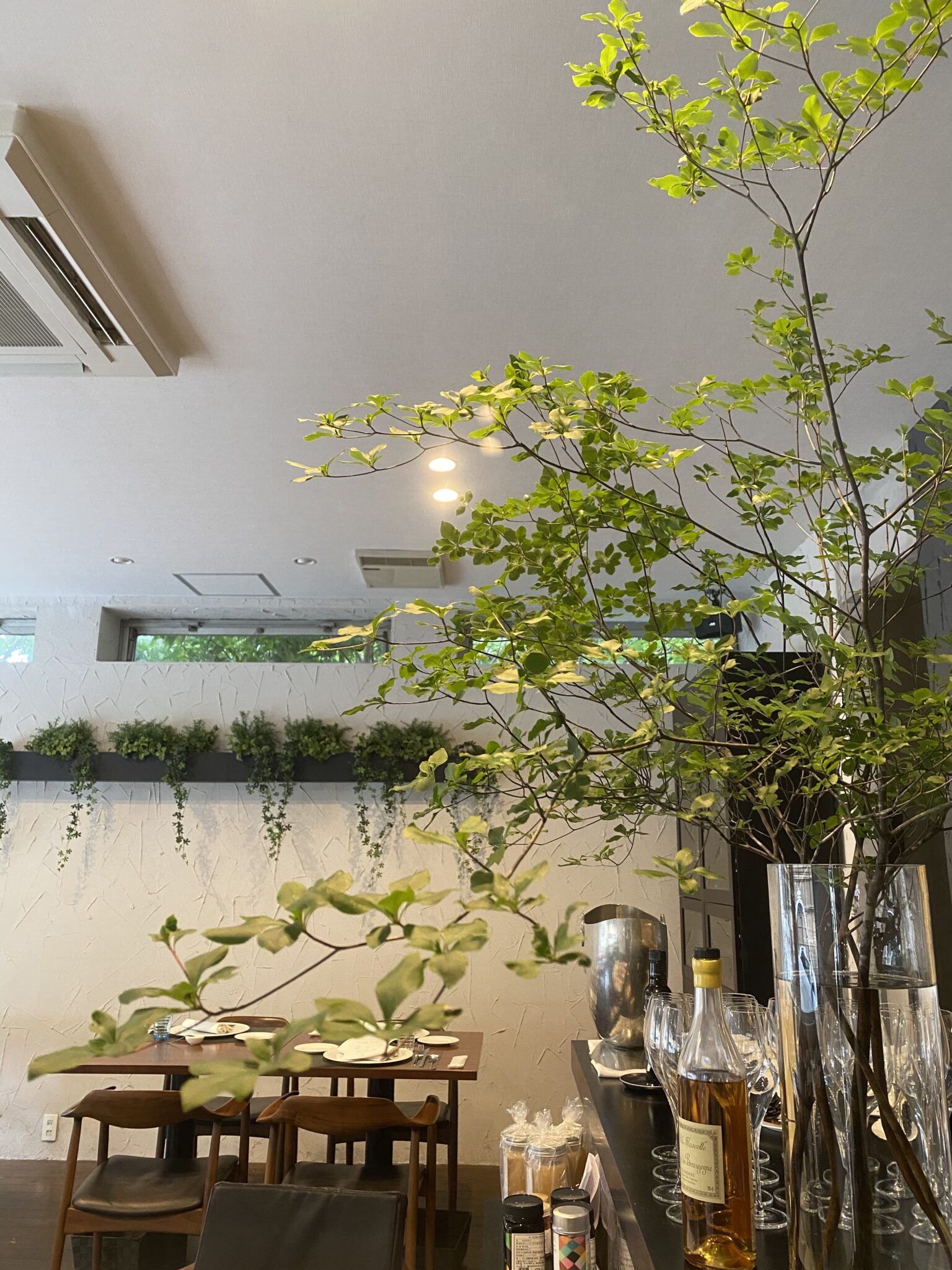 Corporate floral display for a restaurant in Singapore by WOOLLAHRA STUDIO.
